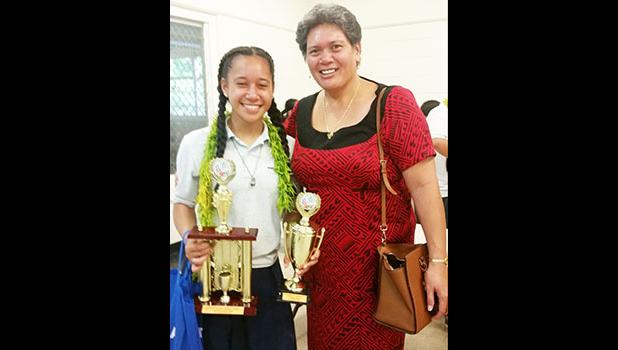 Mrs. Wanda Alofa and her daughter Aitulagi, following the awards ceremony for the Territorial Math Competition held last Friday. Wanda and her husband Papalii donated all the monetary prizes for the winners. Their daughter Aitulagi took home first place for the Grade 10 Division.  Gift certificates and other items were donated by National Pacific Insurance, Bluesky Communications, ASTCA, Manu’a Stores, ASPA, Neil’s ACE Home Center, Happy World, McConnell Dowell, Mrs. Park, and Shikha Sreenivasan. [photo: Bl