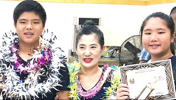 The Lo siblings — Michelle and Kevin — with local math instructor/ tutor Mrs. Seongshim Park