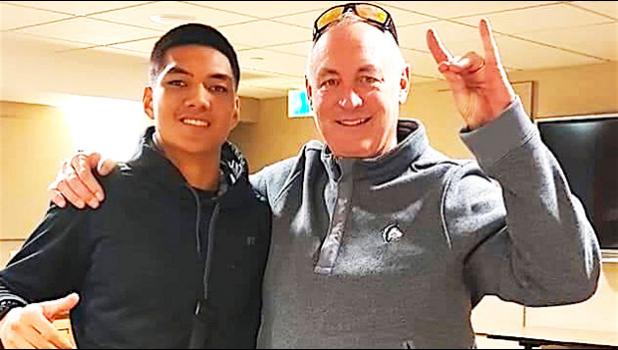 Samoana High School's Darius McMoore with Colorado State University, Pueblo head football coach John Wristen