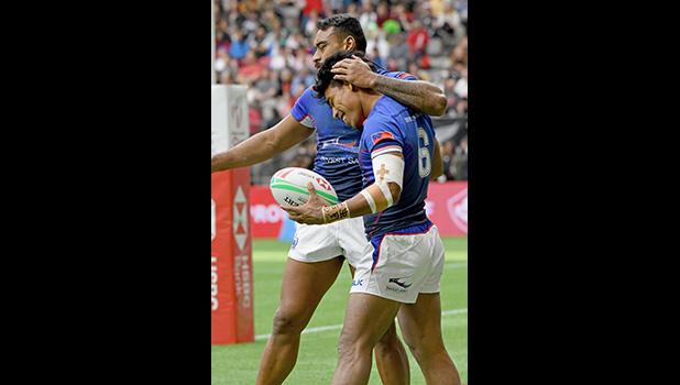 Tila Mealoi is hugged by David Afamasaga 