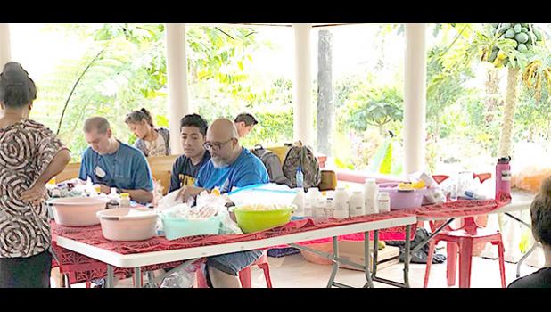 One of the doctors and local volunteer, Duffy Hudson, during one of the clinics in independent Samoa