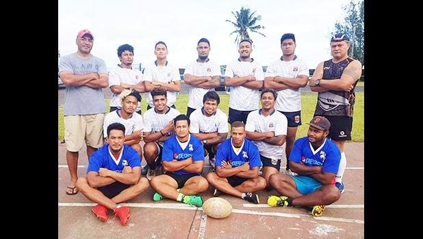 The men's rugby team poses for a group photo. 