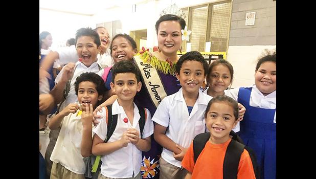 Reigning Miss American Samoa, Magalita Johnson with students.