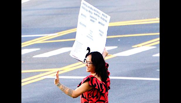 Moira Maiava protesting for better healthcare for American Samoa
