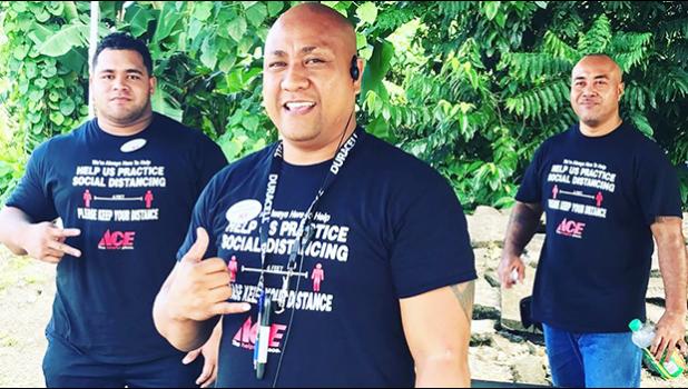 Three Neil’s ACE Home Center employees wearing social distancing t-shirts