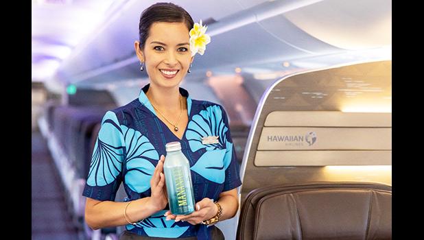 HAWAIIAN AIR FLIGHT ATTENDANT WITH WATER BOTTLE