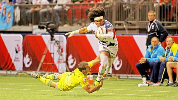 Folau Niua make a powerful drive to set up teamate Maka Unufe's 2nd half try in the USA Eagles 29-5 victory over Australia in Day 1 of the Canada 7s, BC Place Stadium, Vancouver, Canada. [Photo; Barry Markowitz]