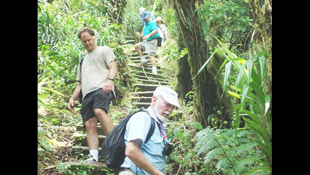 This undated photo provided by the National Park of American Samoa, shows visitors enjoying themselves at one of the park trails. 