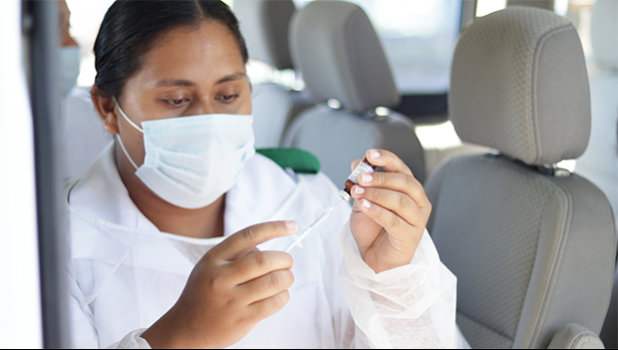 Nurse preparing to administer a vaccination