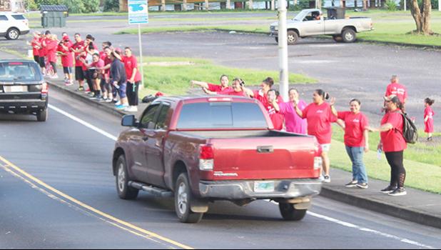 Some of the nurses and their supporters waiving yesterday morning in front of Fagaalu Park