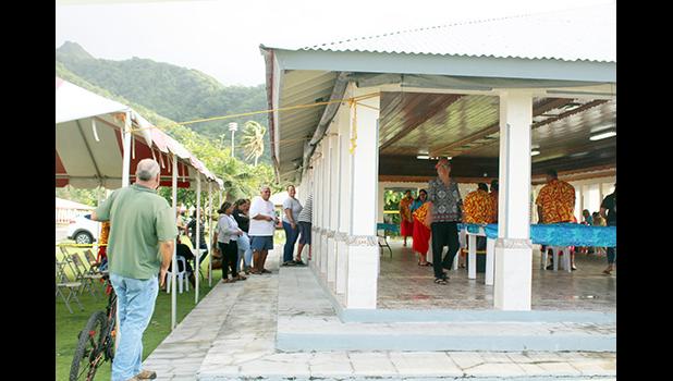 Electors stand in line outside while others were inside the Nu’uuli polling station