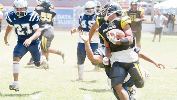 Joe Savaii of the Nu’uuli Wildcats turning on his boosters and beating another Samoana Shark defender to the punch line