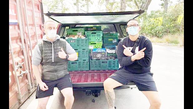 David Letele, right, and his food bank workers 