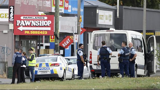 Police stand outside a mosque in Linwood, Christchurch NZ