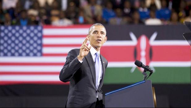 In this July 26, 2015 file photo, President Barack Obama delivers a speech in front of U.S. and Kenyan flags at the Safaricom Indoor Arena in the Kasarani area of Nairobi, Kenya. On Friday, June 29, 2018, The Associated Press has found that stories circulating on the internet that Obama visited his father’s birthplace on a secret trip to Kenya in June 2018 are untrue. (AP Photo/Ben Curtis) Associated Press file photo of former President Obama