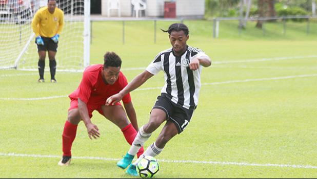 Maro Bonsu-Maro of Tupapa Maraerenga FC trying to control his way around Veitongo FC fullback Tuia Falepapalangi during the opening half of their OFC Champions League Qualifiers this past Tuesday afternoon. Tupapa Maraerenga FC won 9 - 2. All tourney games are played at the Pago Soccer Field. [photo: TG]