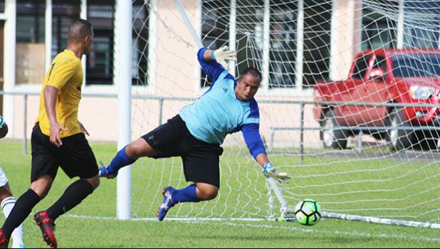 Poyer Samuelu locating the ball, but not able to get to the ground in time as this shot from Suivai Ataga rolls into the goal for his fourth goal of the match. Pago Youth suffered a punishing 1-13 loss against Lupe o le Soaga from Samoa. All tourney games are played at the Pago Soccer Field. [photo: TG]