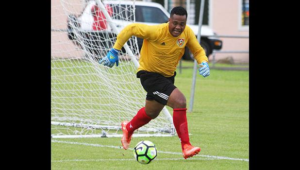 Tongan Goal keeper for Veitongo FC, Motekiai Faupula chasing down the ball inside the keepers box during the second half of their match up against Lupe ole Soaga last Friday. Veitongo lost 6 - 0. [photo: TG]