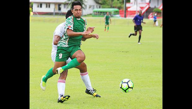 Samuelu Malo (9) of Lupe ole Soaga is tackled from behind from a Veitongo FC defender – a move by the Tongan fullback that resulted in a yellow card warning against Tonga. Malo helped Lupe ole Soaga in their 6 - 0 win. [photo: TG]