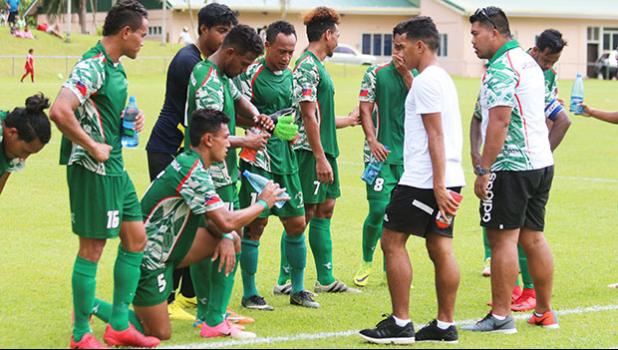 Lupe ole Soaga Head Coach, Paul Ualesi coaching his boys to try and play the ball on the ground and try to prevent keeping the ball in the air too long due to slippery conditions of the field – during the opening half of their match up against Veitongo FC last Friday afternoon. Lupe ole Soaga won 6 - 0.  [photo: TG]
