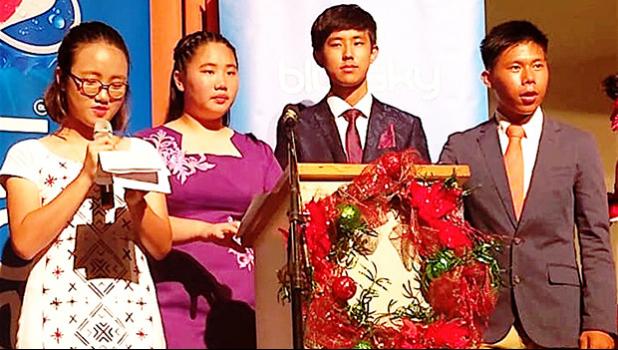 Pictured is Katherine Kim (on the mic) and three of her peers: Michelle Lo, Heyao Yang, and Victor Chen. 