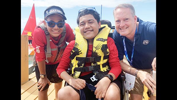 Alofaeleuma Faualo (center) with his crew 11-year old Laser Sailor Carneal Lili’o Satele and Tony Greubel, Charge de Affaires for the US Embassy