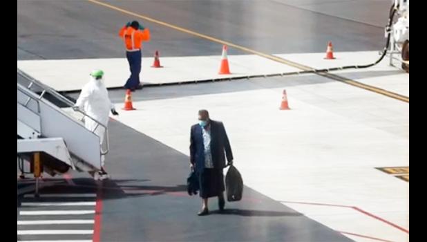 Passenger getting off Air New Zealand plane