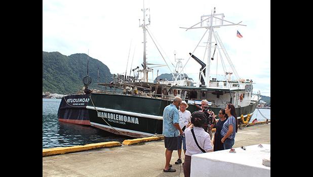 Facing the camera, Carlos Sanchez, a co-owner of several US- American Samoa based longliners is seen with the PBS TV crew.