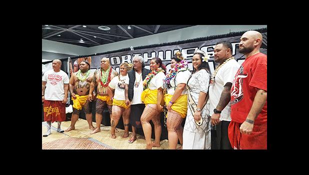 The two men and three women who got their traditional Samoan tatau during the Northwest Tatau Festival held at the Greater Tacoma Convention Center June 30-July 2. Pictured with them is event organizer Whitey Chen (far left), Su'a Suluape Alaiva'a Petelo (center), Ms. American Samoa Antonina Lilomaiava, Su'a Suluape Peter, and Suluape Steve Looney.  [photo: Blue Chen-Fruean]