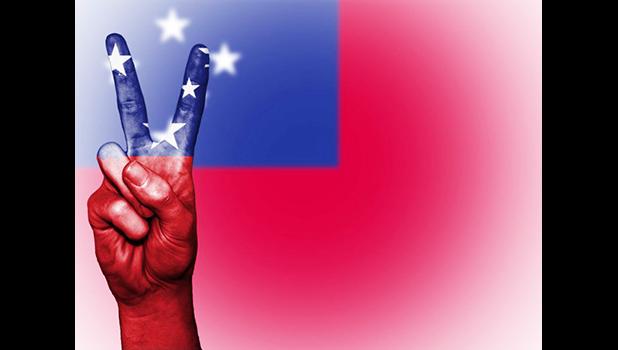 Hand showing the international symbol for peace, decorated in the national colors of Samoa. Flickr page of Public Domain Photography (CC BY-NC-SA 2.0)