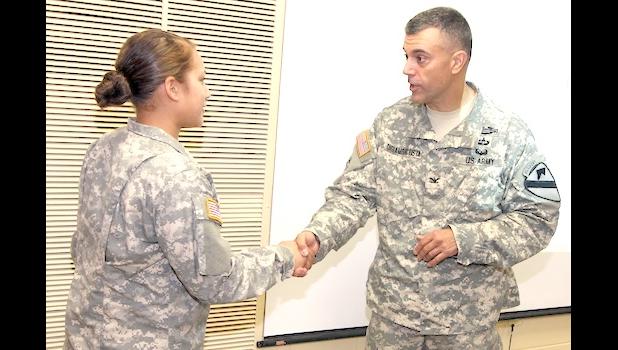 Pfc Theresa Laufasa and officer