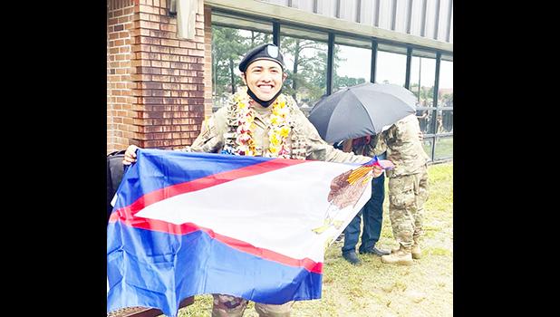 PFC Castro with American Samoa flag