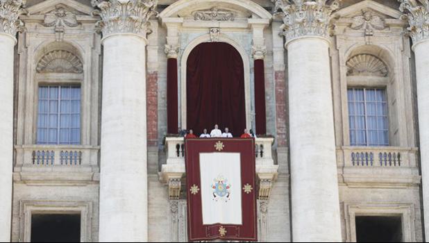 Pope Francis, background center, delivers the Urbi et Orbi (Latin for ′ to the city and to the world’ ) Christmas’ day blessing from the main balcony of St. Peter’s Basilica at the Vatican, Monday, Dec. 25, 2017. (AP Photo/Alessandra Tarantino) Pope Francis, background center, delivers the Urbi et Orbi (Latin for ′ to the city and to the world’ ) Christmas’ day blessing from the main balcony of St. Peter’s Basilica at the Vatican, Monday, Dec. 25, 2017. (AP Photo/Alessandra Tarantino)