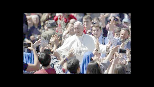 Pope Francis waves to the crowd after celebrating a Palm Sunday Mass in St. Peter's Square at the Vatican, Sunday, April 9, 2017. Pope Francis has blessed palm fronds and olive branches in St. Peter's Square at the start of Holy Week celebrations. (AP Photo/Alessandra Tarantino) Pope Francis waves to the crowd after celebrating a Palm Sunday Mass in St. Peter's Square at the Vatican, Sunday, April 9, 2017. Pope Francis has blessed palm fronds and olive branches in St. Peter's Square at the start of Holy Week celebrations. (AP Photo/Alessandra Tarantino)