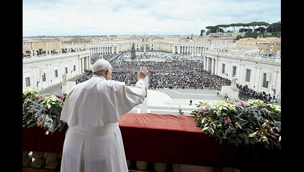 Pope Francis waves to an estimated 70,000 people