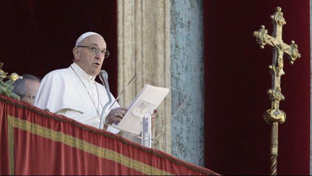 Pope Francis delivers his message during the Urbi et Orbi (Latin for 'to the city and to the world' ) Christmas' day blessing from the main balcony of St. Peter's Basilica at the Vatican, Tuesday, Dec. 25, 2018. (AP Photo/Alessandra Tarantino) Pope Francis delivers his Christmas message