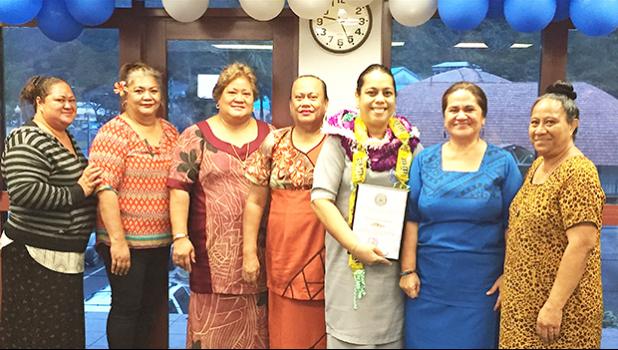 Manulele Tausala Elementary School principal, Martha Sagapolutele (third from right) with her award Certificate, after being named the “Principal of the Year” - school year 2017-2018.