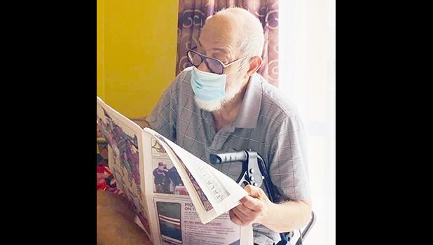 85-year old Si’i Noaese Taeatafa reading Samoa News