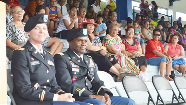 US Army Recruiting Commanders, Capt. Carneen Cotton (left) and Maj. Ulisses Tymes with parents, families and friends who witnessed the swearing-in of 31 of the 80 DEP enlistees as future US Army soldiers at the Veterans Memorial Stadium on Wednesday afternoon.  [photo: AF]