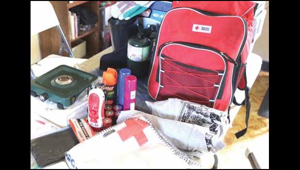 Pictured are some of the items being distributed by the American Red Cross to families whose homes were aff ected by Tropical Storm Gita last month. Th e care kits include necessities such as fl ashlights, batteries, fi rst aid kit, tarp, burner, and a cooler. [photo: THA]