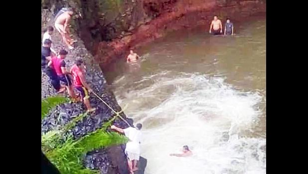 Rescuers attempting to locate Perez after he dived into the pool at Togitogiga Falls