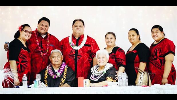 This  family photo shows the late Rev. Elder Dr. Pati Puia’i Vaeao sitting next to his wife of 47 years, Siafiafilelei Thompson Leasau, surrounded by family members