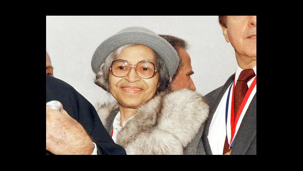 This Oct. 28, 1986, file photo shows Rosa Parks at Ellis Island in New York. The AP reported on Aug. 25, 2017, that a story circulating online that Parks' daughter praised President Donald Trump's response to violence in Charlottesville, Va. is false. Parks didn't have any children. (AP Photo, File)