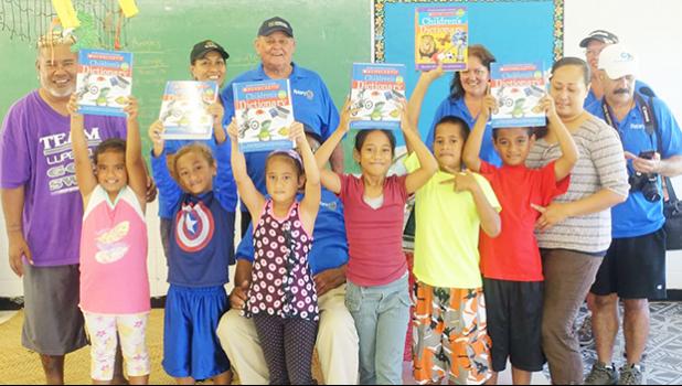 Faleasao Elementary School kids with their dictionaries and Rotarians