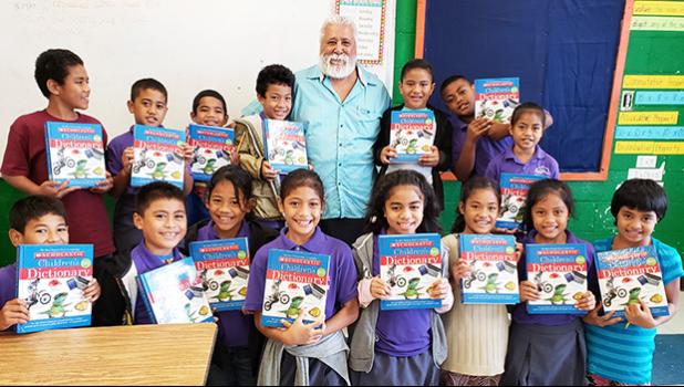 Rotary Club of Pago Pago vice president, Peter Tinitali presented dictionaries to the 3rd graders of Siliaga Elementary School.
