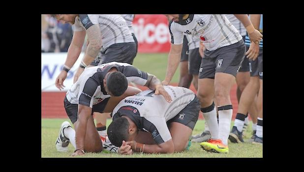 An emotional and fatigued Fiji Bati team celebrates their 20-18 victory over Toa Samoa at Apia Park, Samoa, 10/8/16. [Photo: Barry Markowitz]
