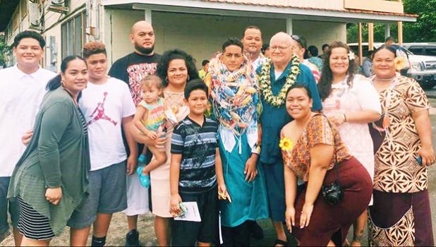 Former Associate Judge Siaki Logoai with his family, following the 8th grade graduation ceremony at the Home of the Flames last Thursday where his grandson Sam was one of 35 who received their diplomas. [photo: BC]