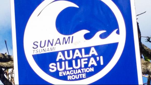  A sign directs people to the tsunami escape route on Samoa's Lalomanu Beach.