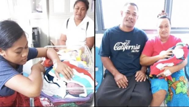 Two of Samoa's Christmas babies with parents