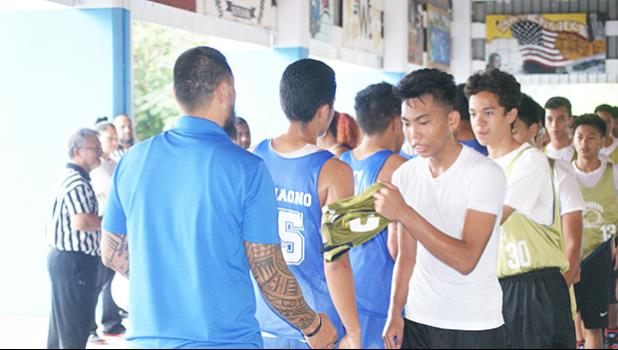 Samoana Sharks shake hands with Marist Crusaders after winning the Junior Varsity Basketball Division last Saturday morning at the Samoana High School Gymnasium in Utulei.  [photo: Ese Malala]